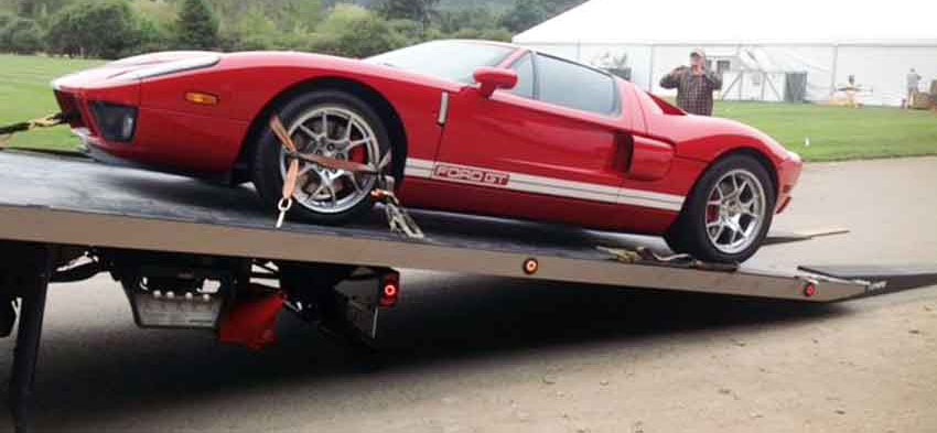 Protect your sports car with a flatbed tow truck!